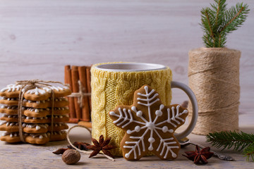 Mug of hot cocoa, good image to convey a feeling of winter and warmth. Winter drink - hot chocolate with cinnamon and anise on wooden background. Coffee with milk