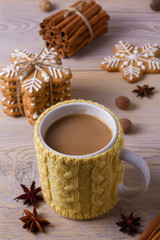 Mug of hot cocoa, good image to convey a feeling of winter and warmth. Winter drink - hot chocolate with cinnamon and anise on wooden background. Coffee with milk