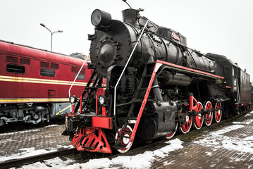 Vintage restored locomotive with steam engine.