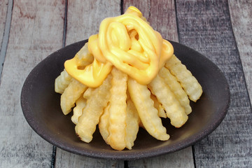 Volcano French fries as French fries topped with cheese arranged is like the volcano .