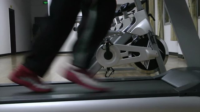 A man runs on a treadmill