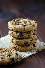 Cookies with chocolate on dark background.