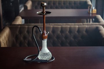 Stylish hookah made of glass and wood