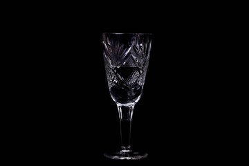 The wine glass on black background