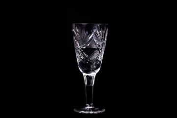 The wine glass on black background