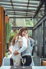 asian woman hug her boyfriend. she is very glad.