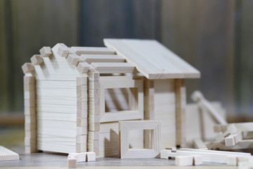 Toy wooden house. The constructor is made of natural wood for ch