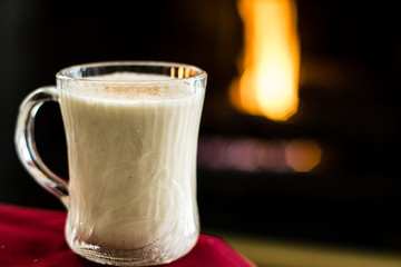 Eggnog by fireplace