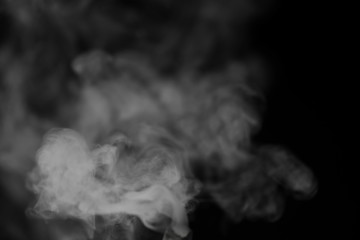 White smoke on a black background. Texture of smoke. Clubs of wh