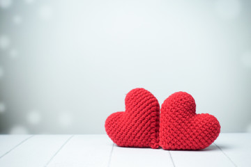 Two red heart on wooden with white background