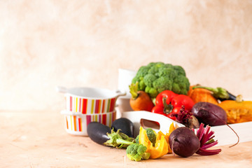 Ware for soup and vegetables on a table. Selective focus. Copy space