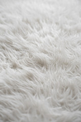 close up of a white wool rug