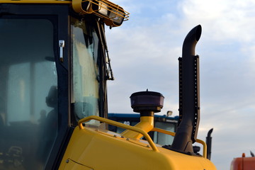 Yellow Bulldozer and its  muffler