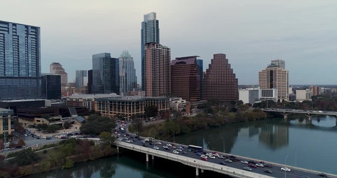 AUSTIN, TX - Circa December, 2017 - A rising dusk aerial Austin city establishing shot on an overcast evening.  	