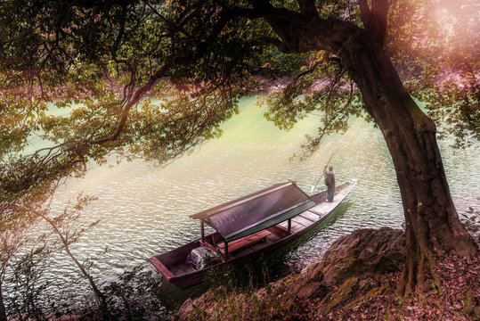 Boatman Punting The Boat At River In Japan.