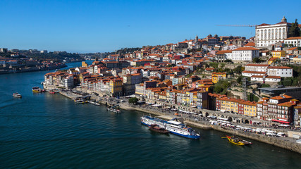 Fototapeta na wymiar Bird's-eye view Douro river and Ribeira from Dom Luis I bridge in old downtown of Porto, Portugal.