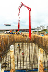 construction building works with concrete pump