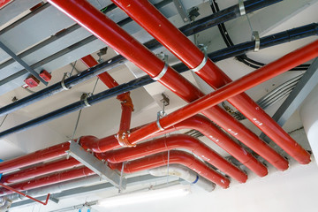 Red Water pipe system. Pumping systems for industrial plants. Construction work. Installation of...
