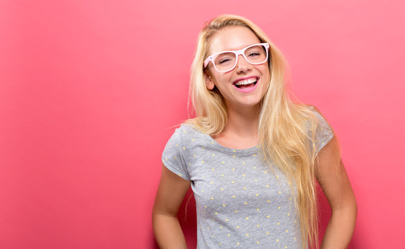 Happy Young Woman On A Solid Background