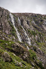Waterfalls running down rock walls in Ireland. 