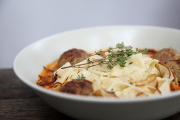 Pasta meatballs tomato sauce on wood background