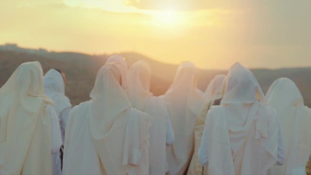 Jewish men prayer With Talit and shofar in sunset