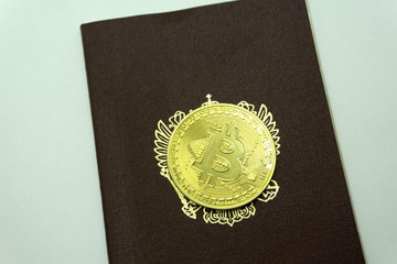 golden bitcoin coin on us dollars close up