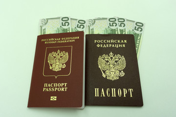 money in a passport, a lot of dollars in hand, capital for travel, savings, emigration .