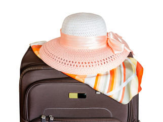 Brown suitcase and hat isolated on white background