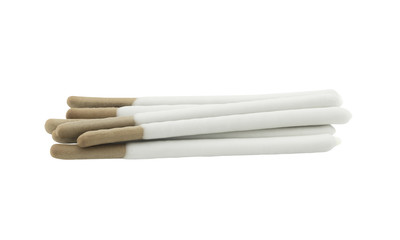 pile of biscuit sticks coated with white chocolate isolated on white background