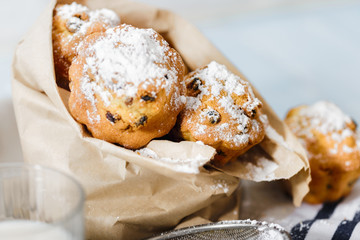 homemade cupcakes with raisins and powdered sugar
