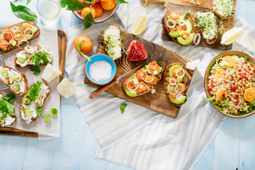 Bruschetta with tomatoes, cucumbers, Brussels sprouts, salad with chickpeas, quinoa