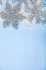 Silvery snowflakes on a blue background