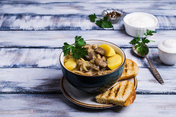 Transparent soup with oyster mushrooms