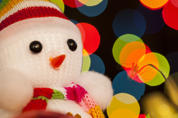 Festive snowman with Christmas light background