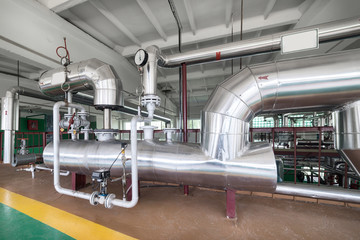 Industrial boiler room. Complex system of pipelines, pumps.