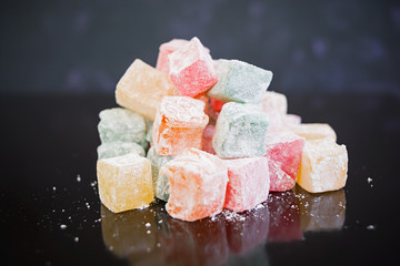 Turkish delights lokum on dark background