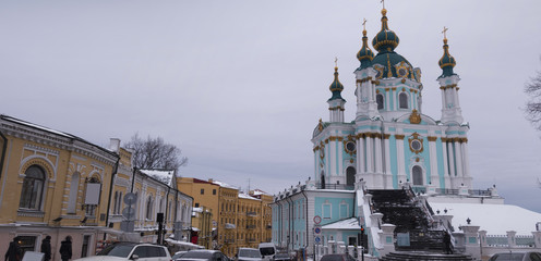 Ancient street in Kiev Andreevsky Descent and St. Andrew's Church, winter day