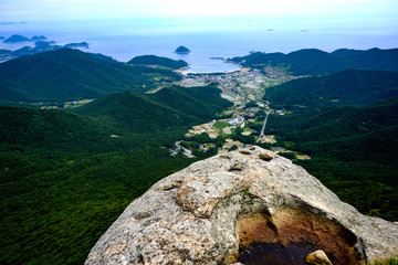 Rocky peak overlooking seaside village