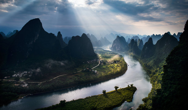 Sunbeams over Li river and mountains, Guilin, China