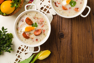 Traditional Polish white borsch with Easter decoration