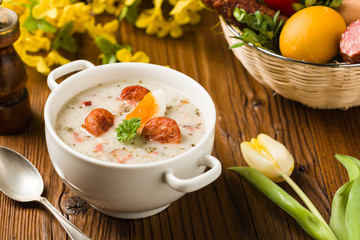 Traditional Polish white borsch with Easter decoration