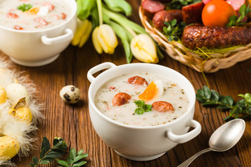 Traditional Polish white borsch with Easter decoration