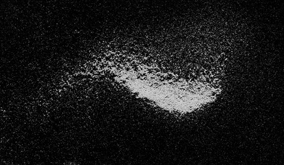 Washing powder, detergent isolated on black background, top view