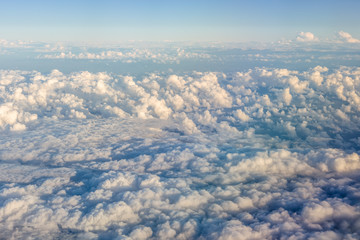 Fototapeta na wymiar Flying above the clouds. view from the airplane