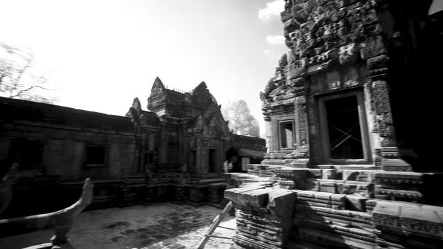 Slow whip pan across the many ruins of Banteay Srei temple in Angkor Wat Archeological Park.
