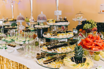 Sweet wedding buffet with different of desserts and fruits.