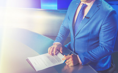 TV presenter preparing to live streaming video