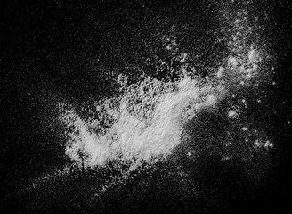White powder, isolated on black background, top view