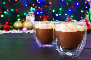 Cup of hot cocoa with marshmallows on Christmas background